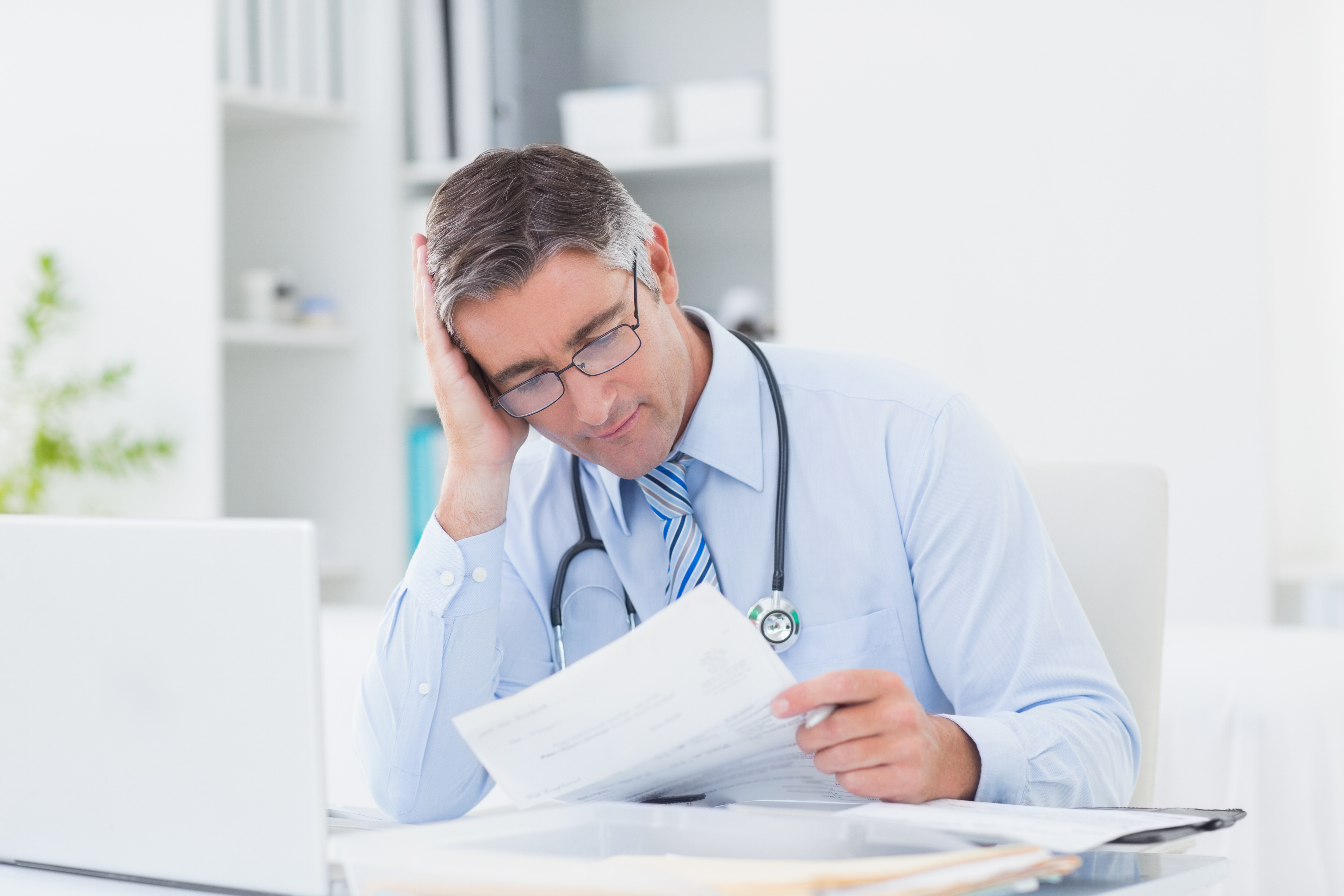 Doctor reading correspondence