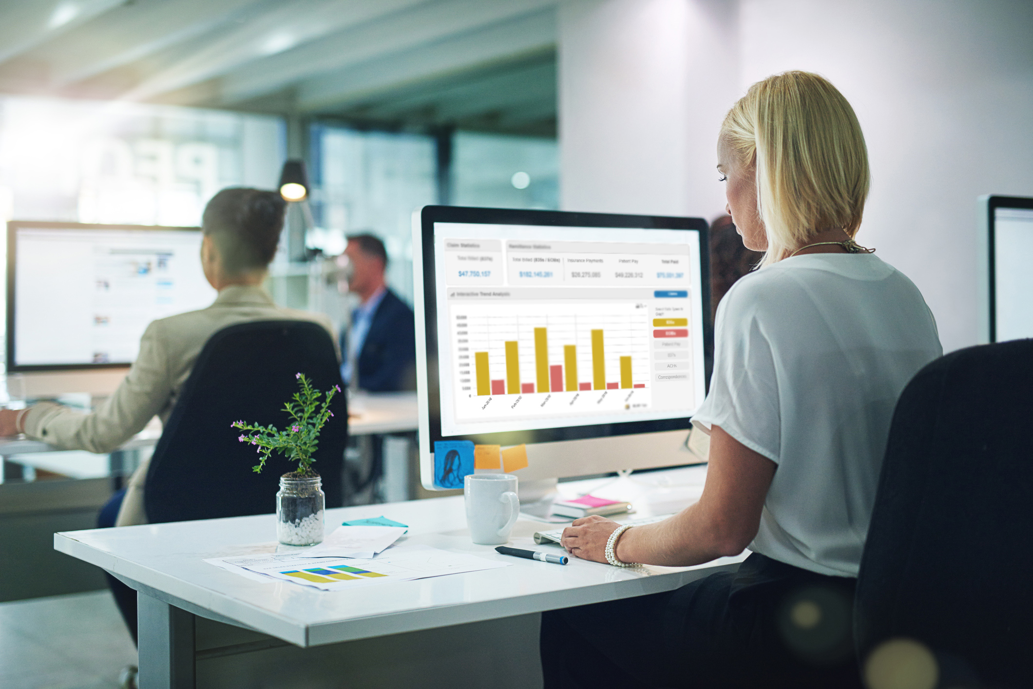 Cropped shot of a group of businesspeople working in the office