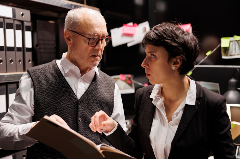 Old,Private,Investigator,Working,Overhours,At,Criminal,Case,With,Police