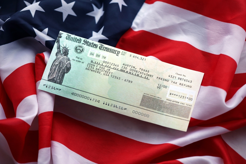 United,States,Treasury,Refund,Check,On,Waving,American,Flag,Close