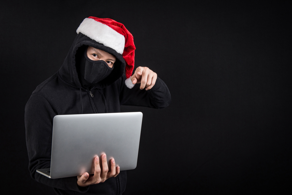 Mysterious,Male,Santa,Hacker,Holding,Laptop,Computer,,Anonymous,Man,On