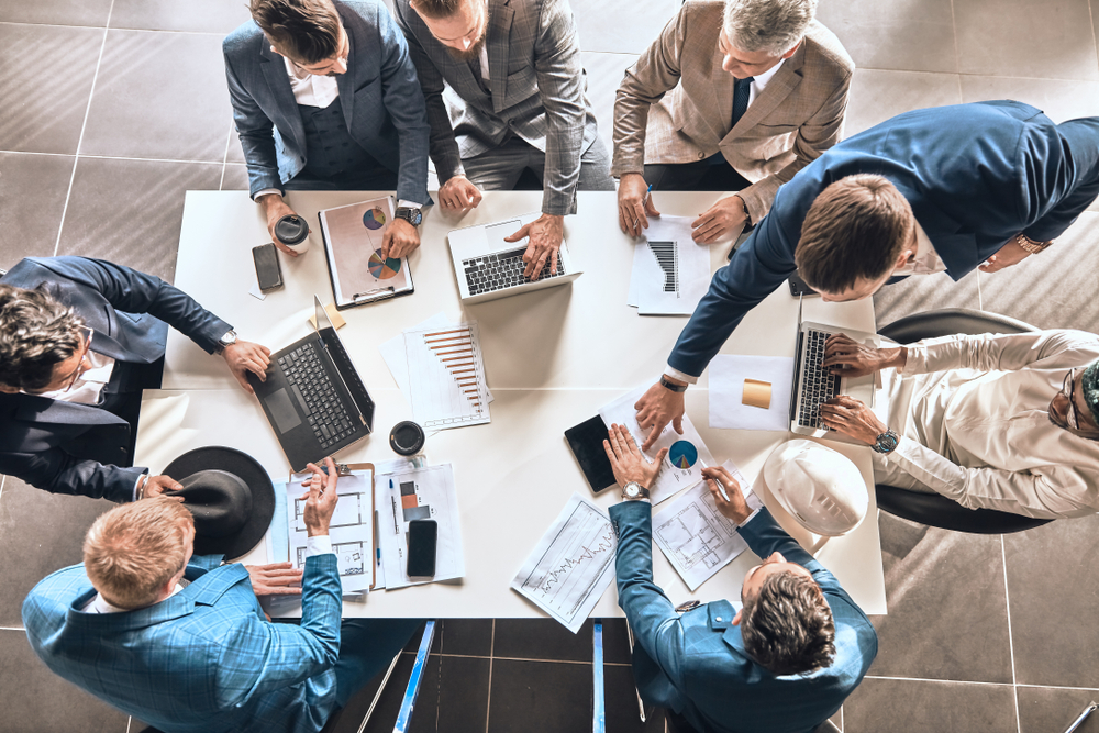 Successful,Partners,Are,Sharing,Experience,In,The,Office,Roo,,Top